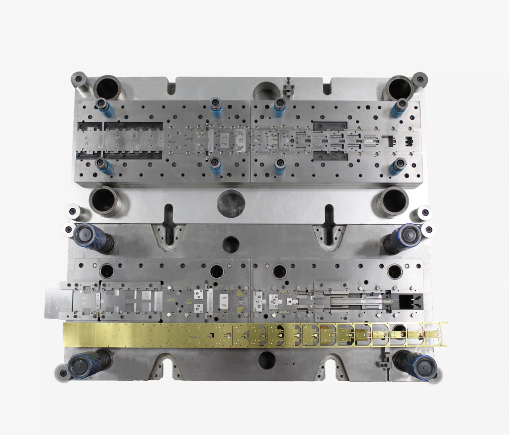 Progressive stamping die with forming and restrike stations that control springback