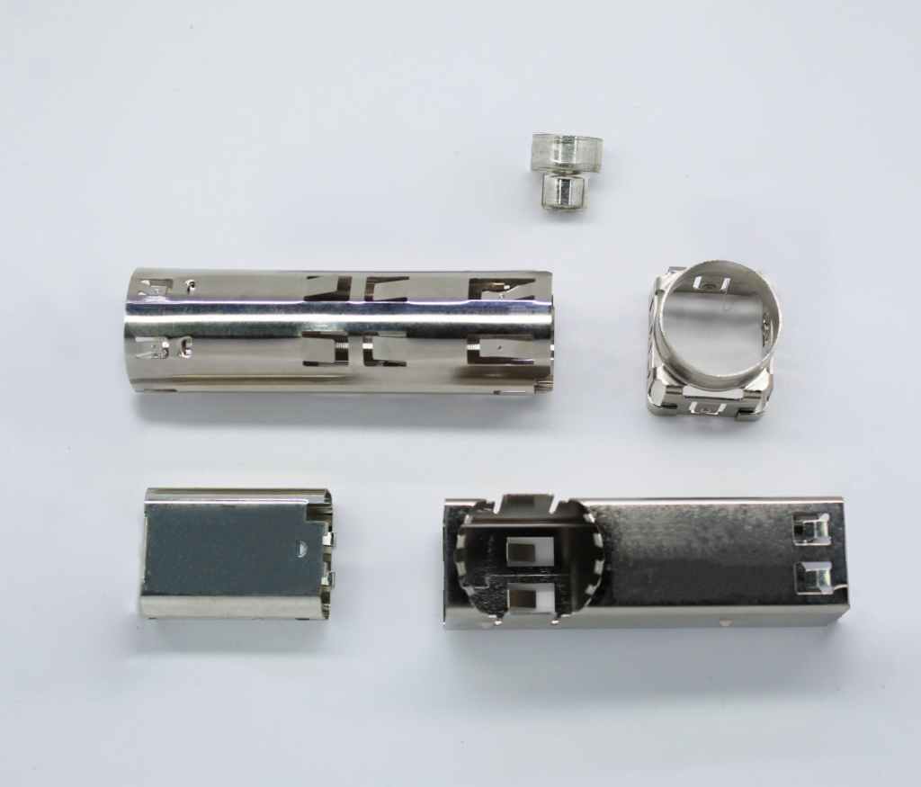 Stamped shells and formed parts where springback control holds the bend angles