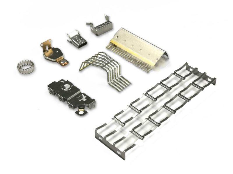 Custom metal stamping parts including connector shells, contact springs, brackets and shield frames made to customer drawings